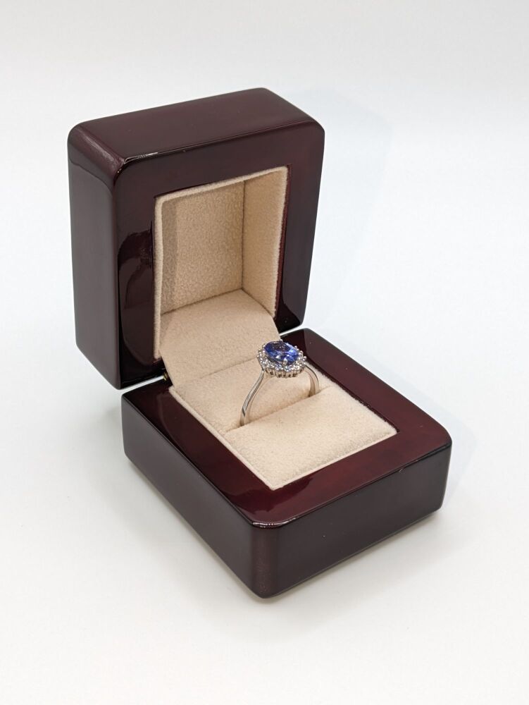 Oval cut Tanzanite in diamond halo 1.95ct Total VS1/ F
