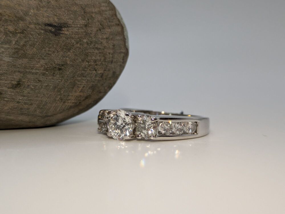 Graduated Trilogy ring with channel set shoulders 2.40ct Total VS1/ D