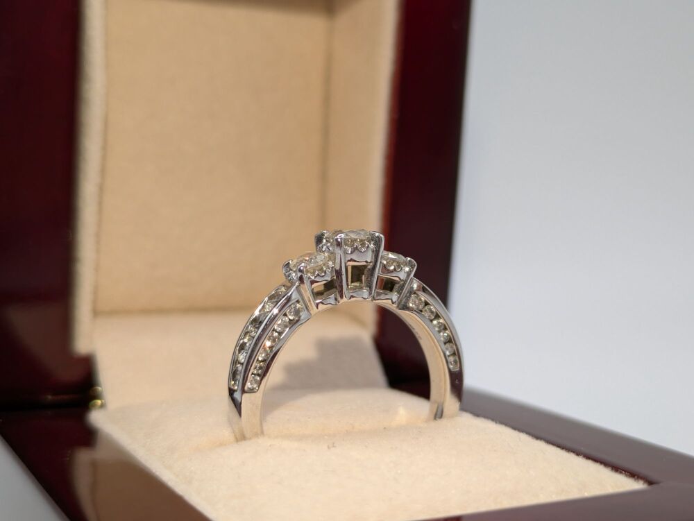 Channel Shoulder set Trilogy ring with diamond accents 1.20ct VS1/E