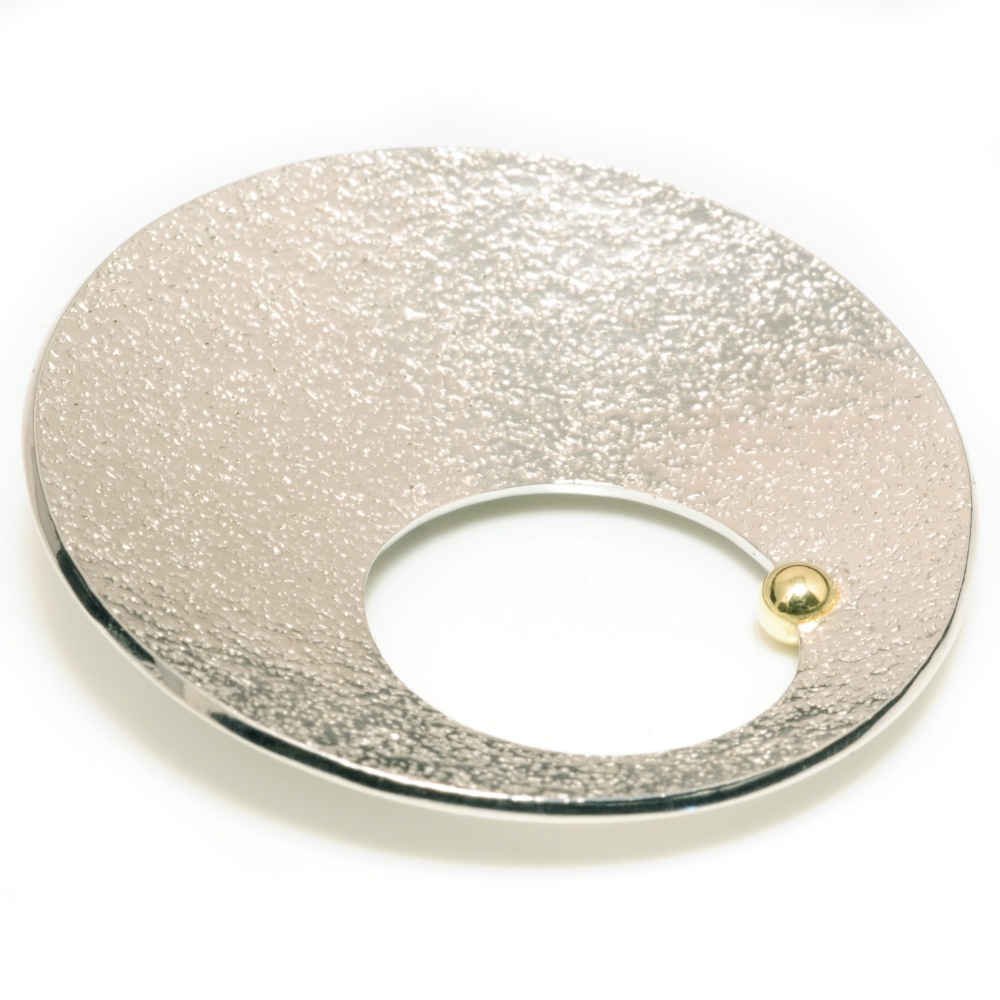 Silver concave textured brooch with hole and gold ball detail
