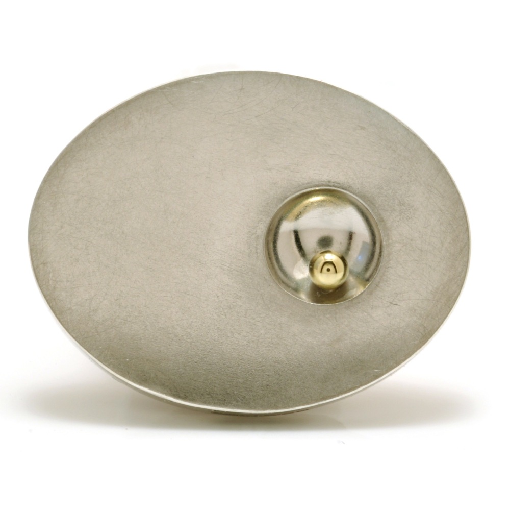 Silver hollow oval brooch with concave detail with gold ball