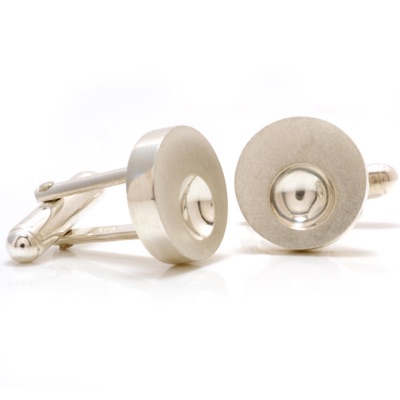 Silver hollow cuff links with shiny round concave detail