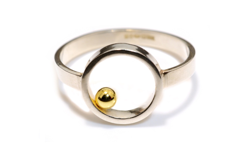 Silver flat circle ring with gold ball detail