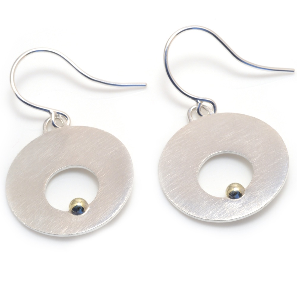 Silver disc earrings with cut out circle and gold ball detail