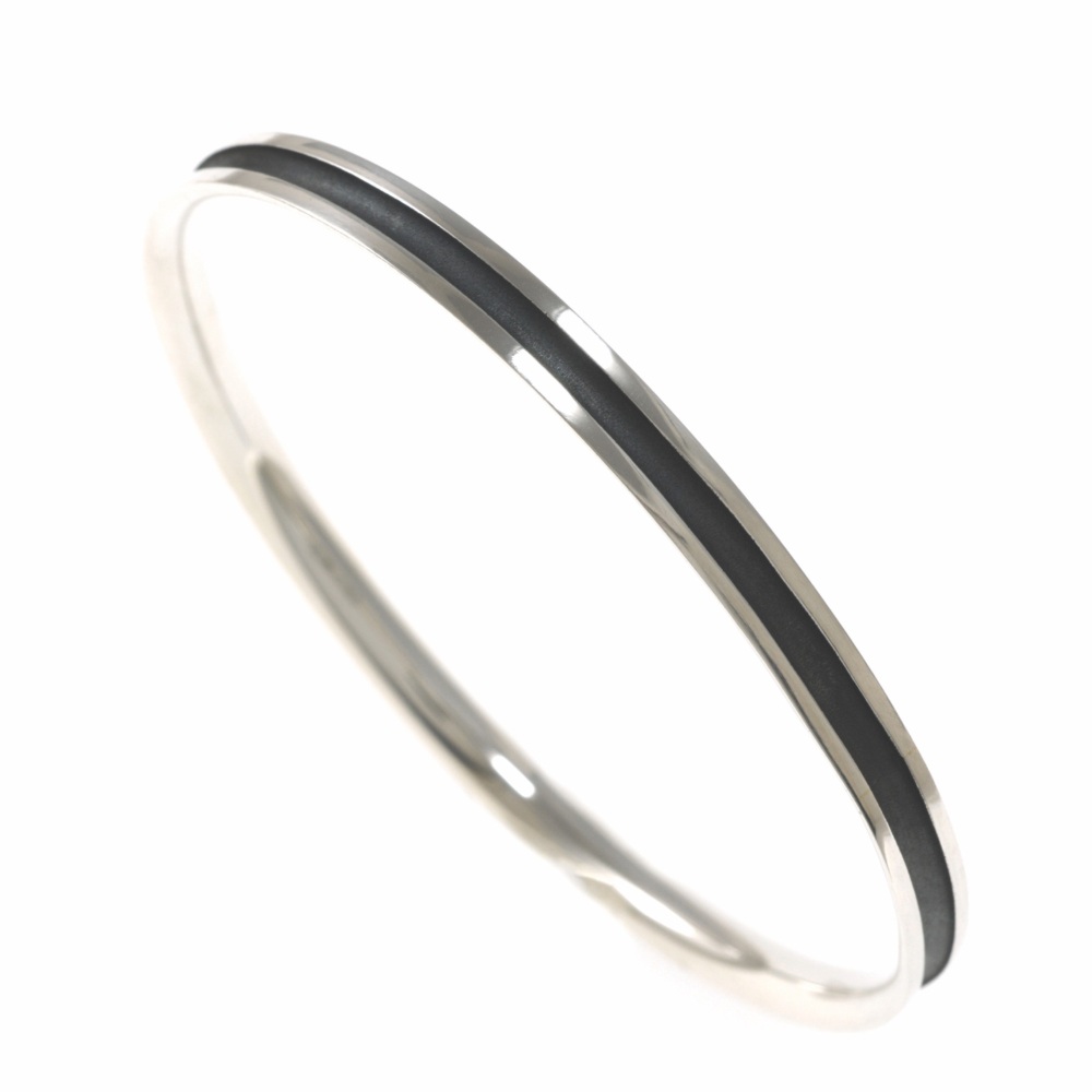 Slim radius bangle with oxidised silver groove