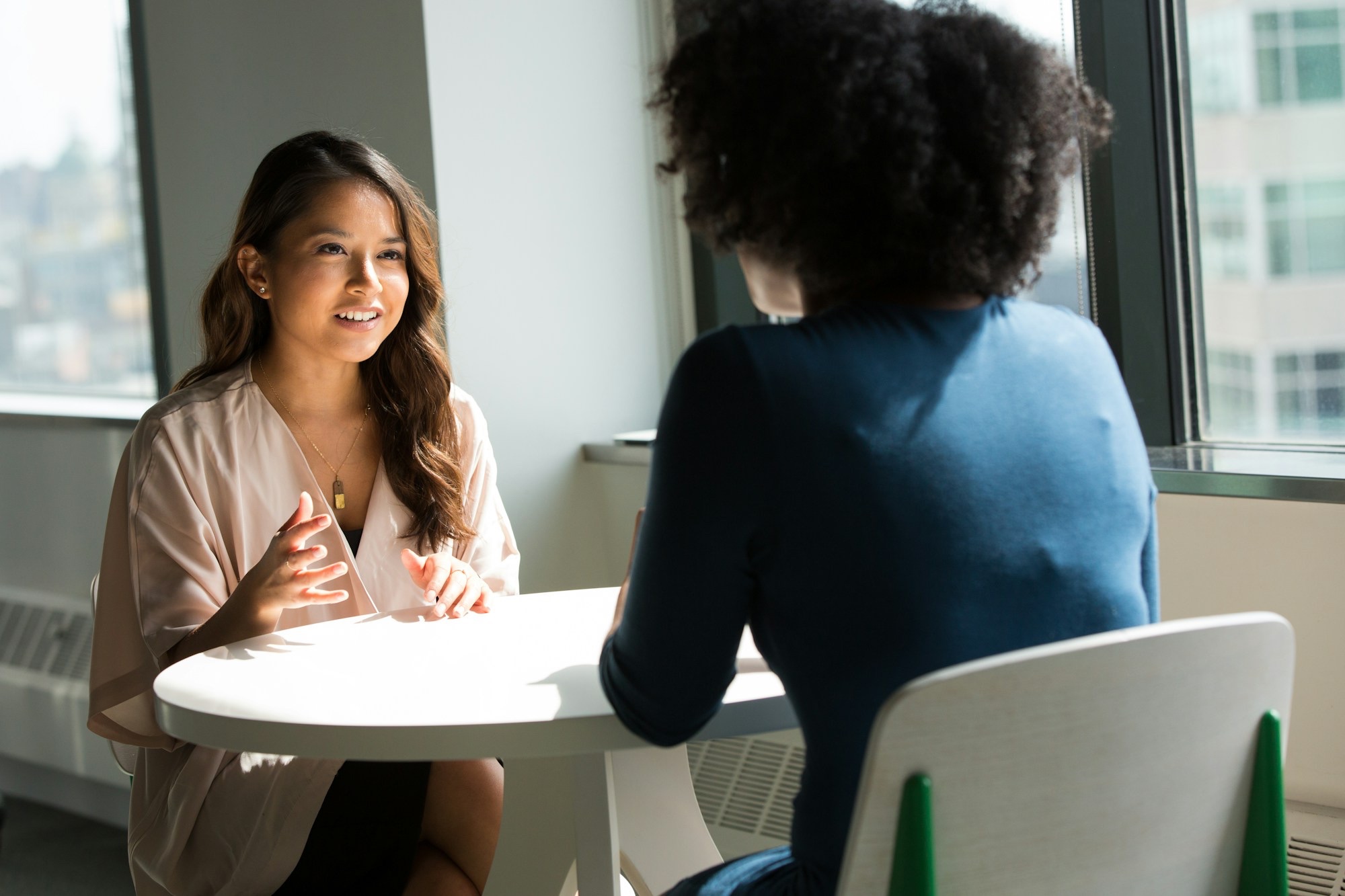 two-women-sitting-on-chair-eF7HN40WbAQ.jpg