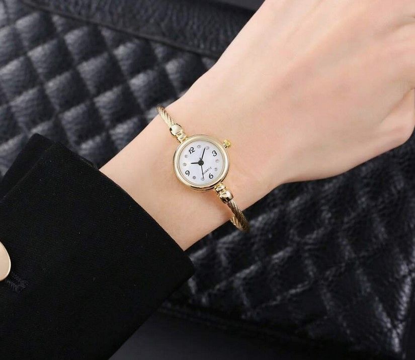 Delicate Open Bangle Bracelet Watch with simple quartz watch dial.