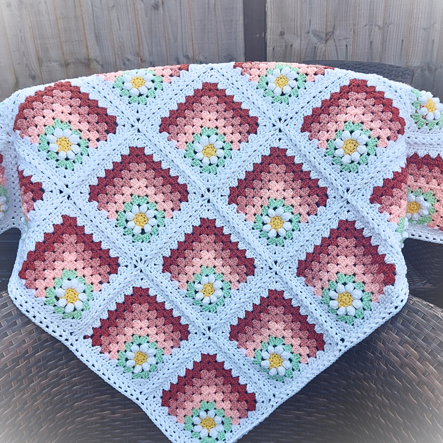 Daisy Crochet afghan blanket in shades of peach