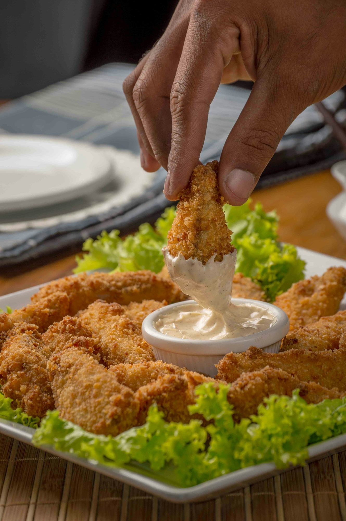 person-dipping-fried-cuisine-on-dip-CLMpC9UhyTo.jpg