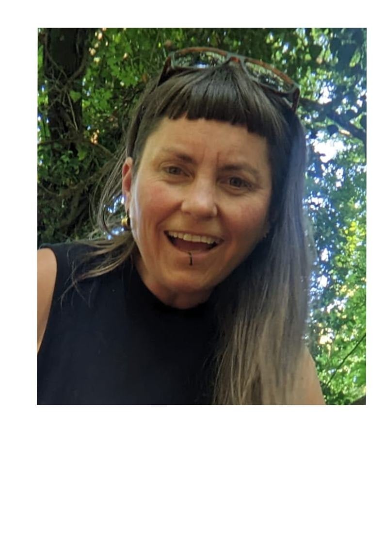 Alice Bowley smiling in the woods