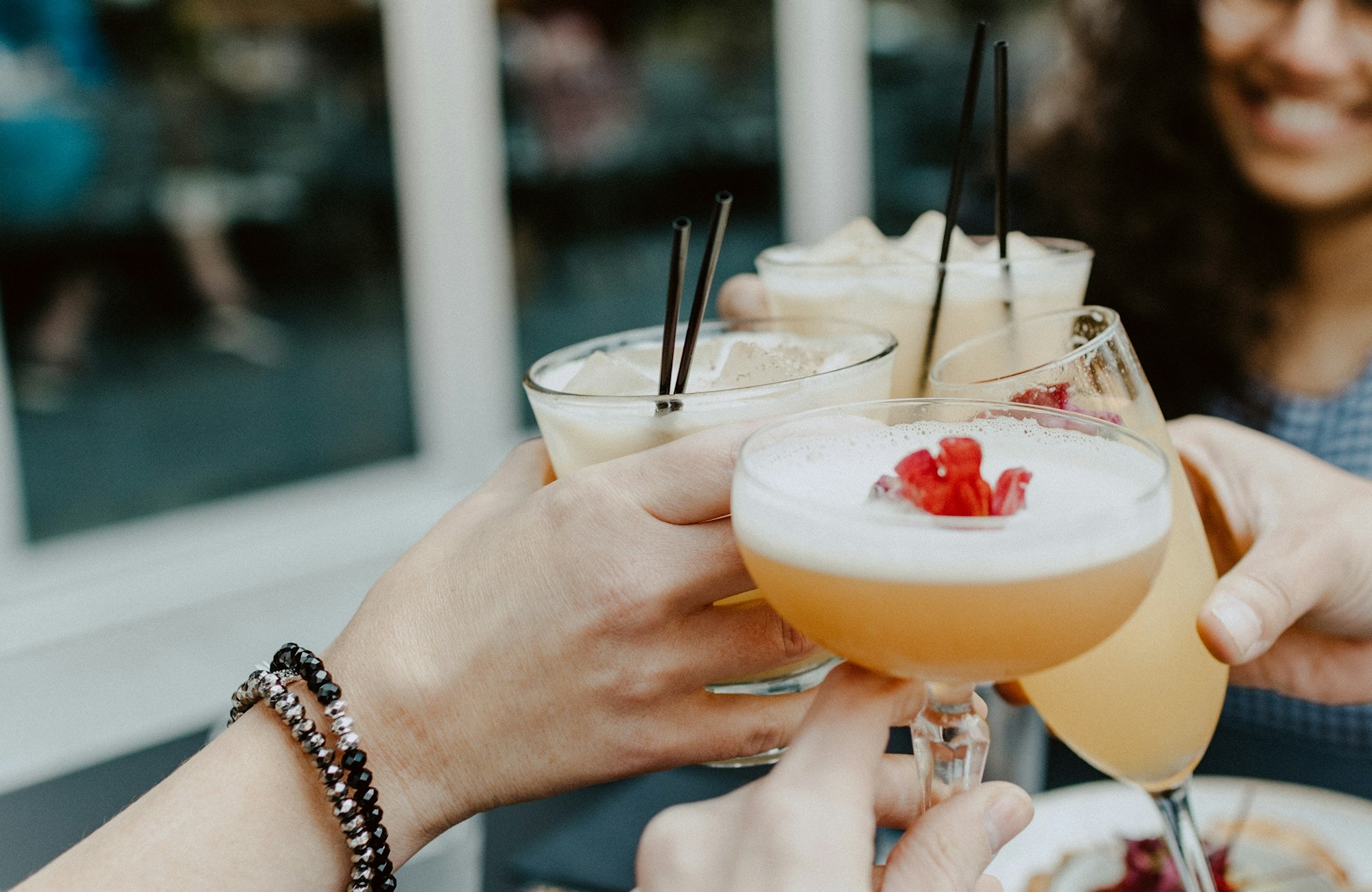 person-holding-filled-drinking-glasses-AgJdd_HgFPw.jpg