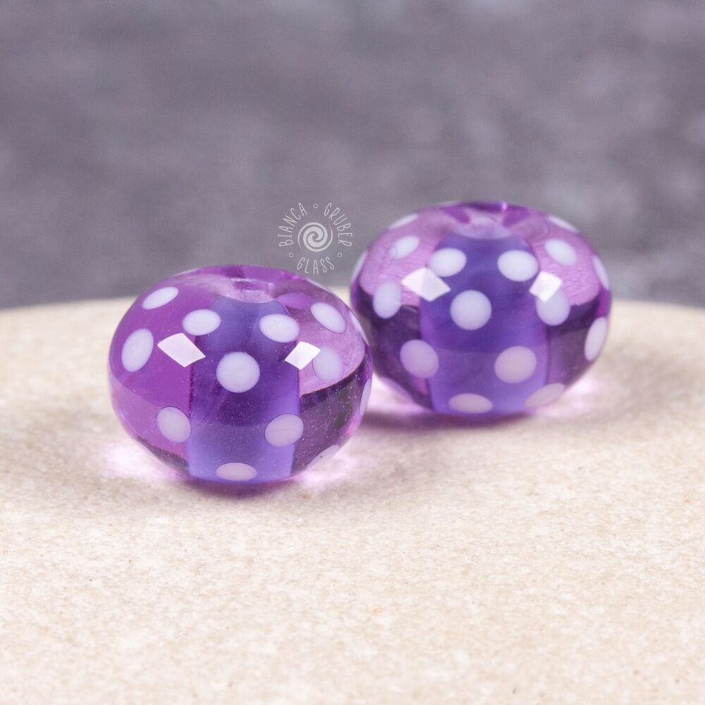 Pair of encased small dot beads - purple