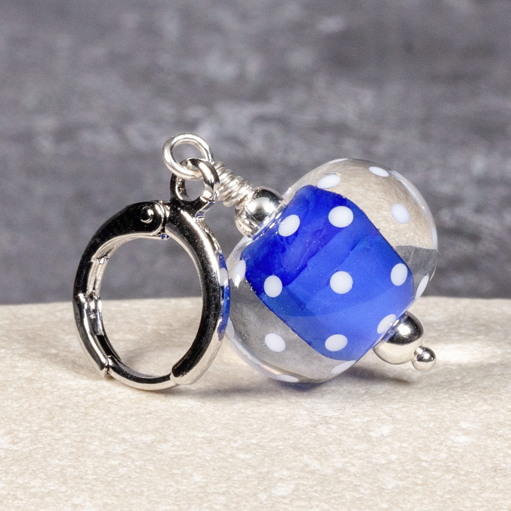 One glass encased stitch marker – dark blue core