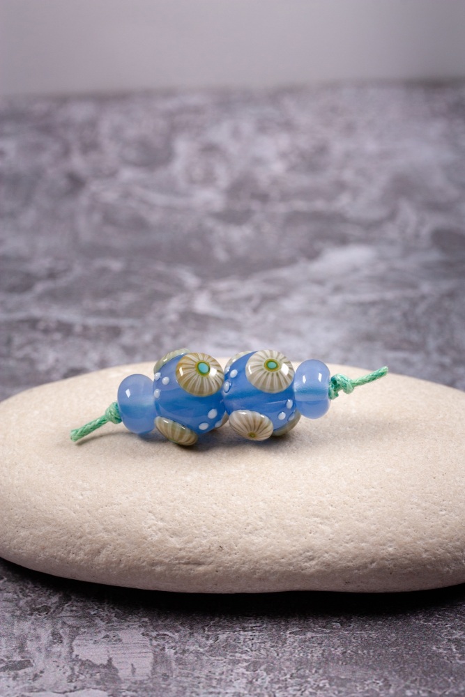 Moonstone blue bead pair of round beads with pale green murrini