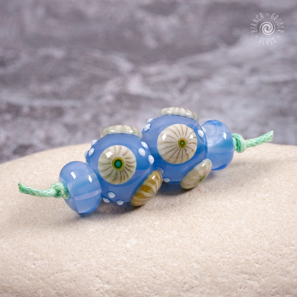 Moonstone blue bead pair of round beads with pale green murrini