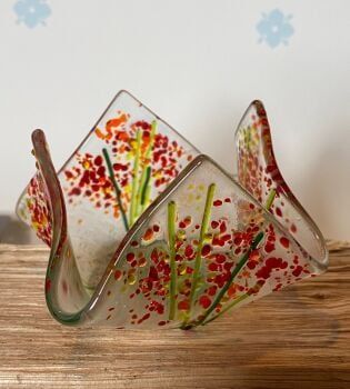 red draped candle dish
