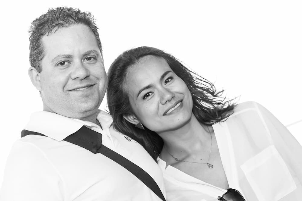 a black and white photo of a man and woman clearly in love