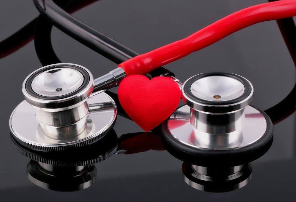 a stethoscope wrapped around a fabric heart