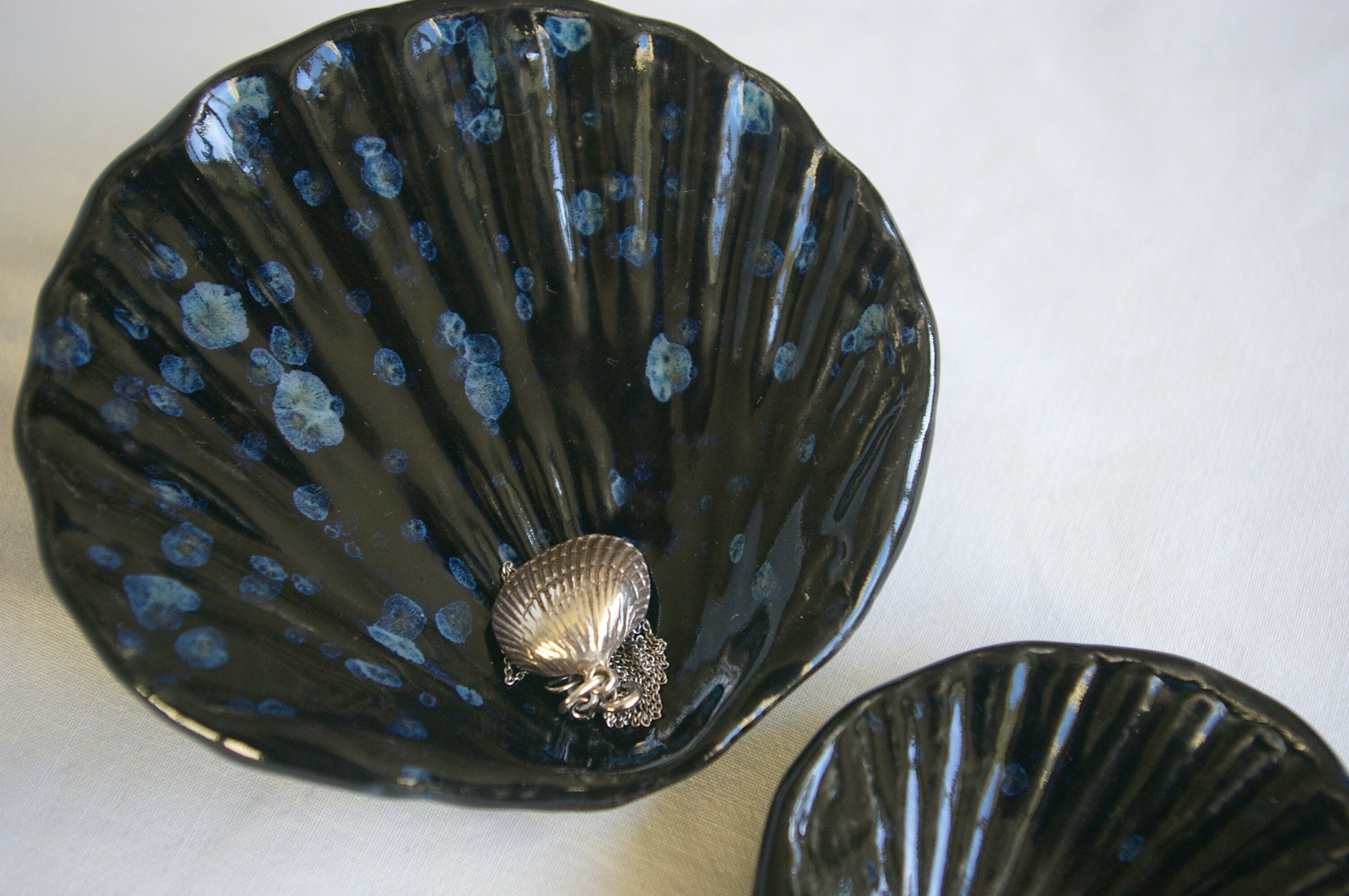 Obsidian both with scallop