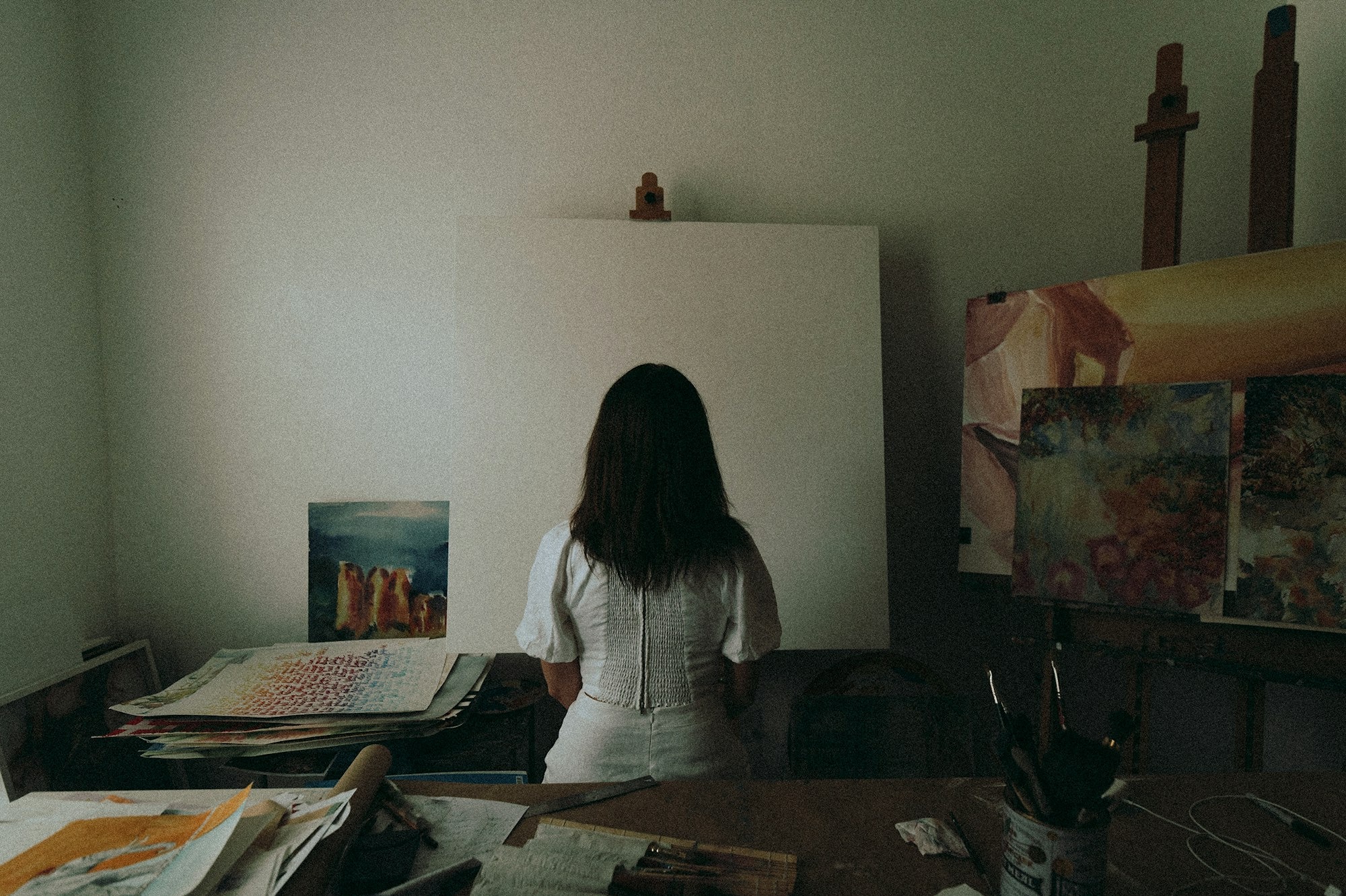 woman-in-white-long-sleeve-shirt-sitting-on-chair.jpg