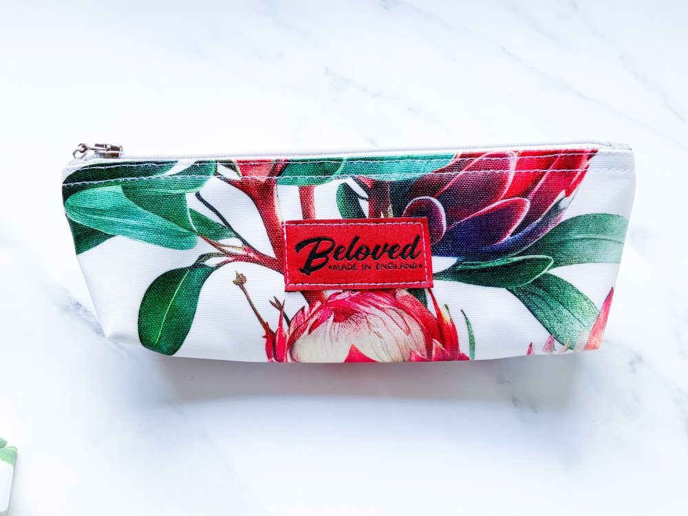 Bold orange/rust protea skinny cosmetic bag