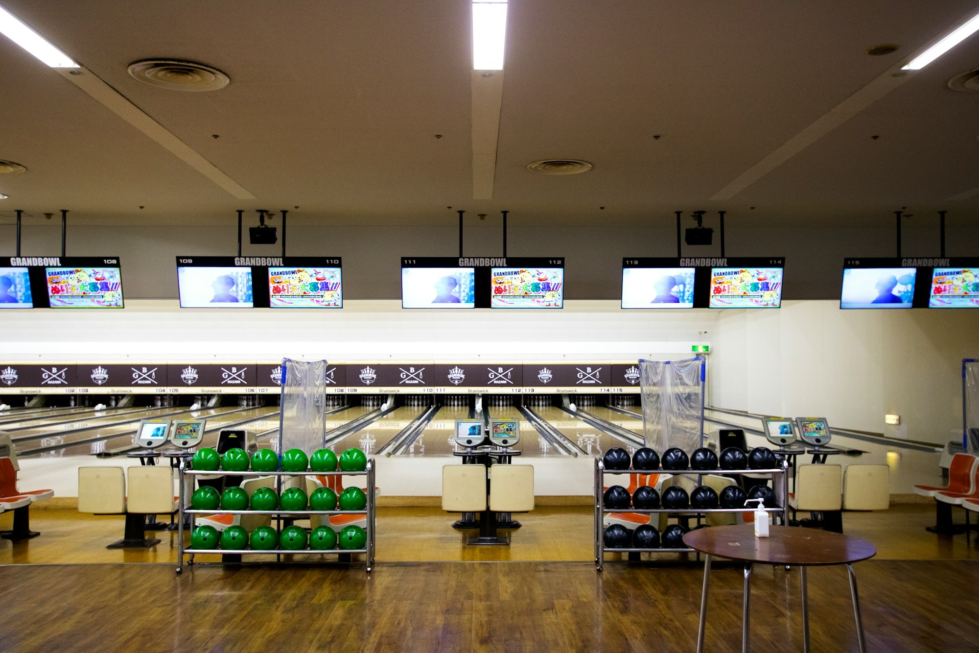 a-bowling-alley-filled-with-bowling-balls-and-tvs-hbrX9b0p06o