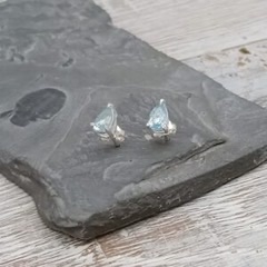 FACETED BLUE TOPAZ TEARDROP STUDS SET IN STERLING SILVER