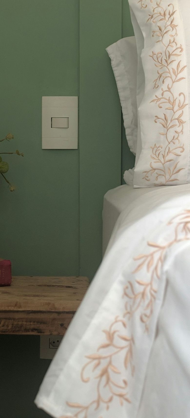 a-bed-with-a-white-comforter-and-pillows-gzx1BM1Ic_4