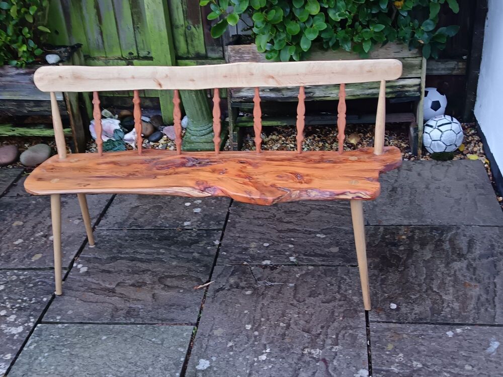 Yew Wood bench with rustic waney edges and a style of its own