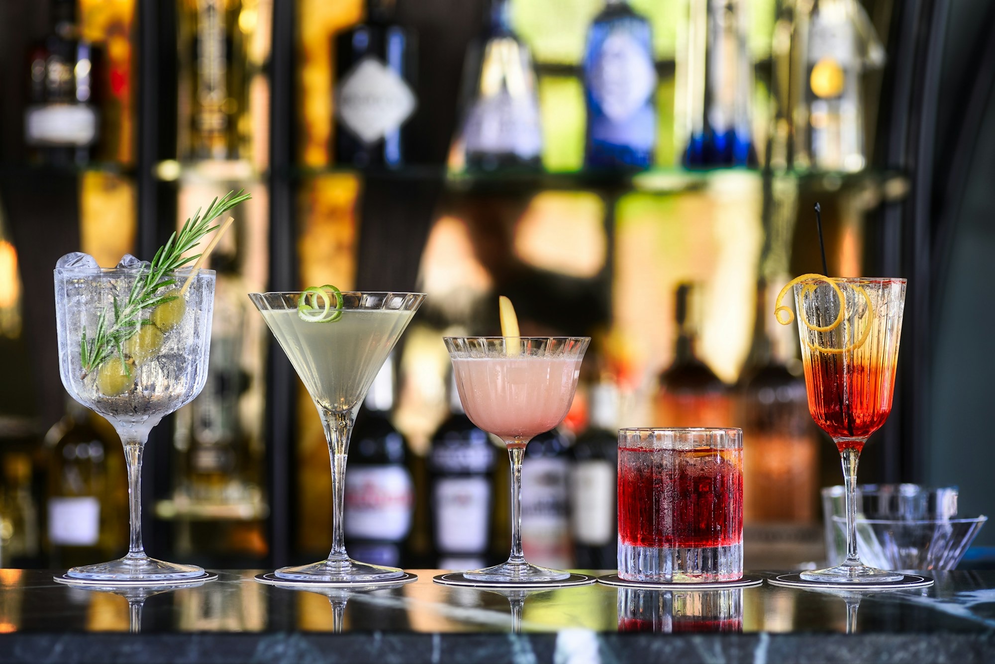 clear-cocktail-glass-with-pink-liquid-inside-QYWYnzvPTAQ.jpg
