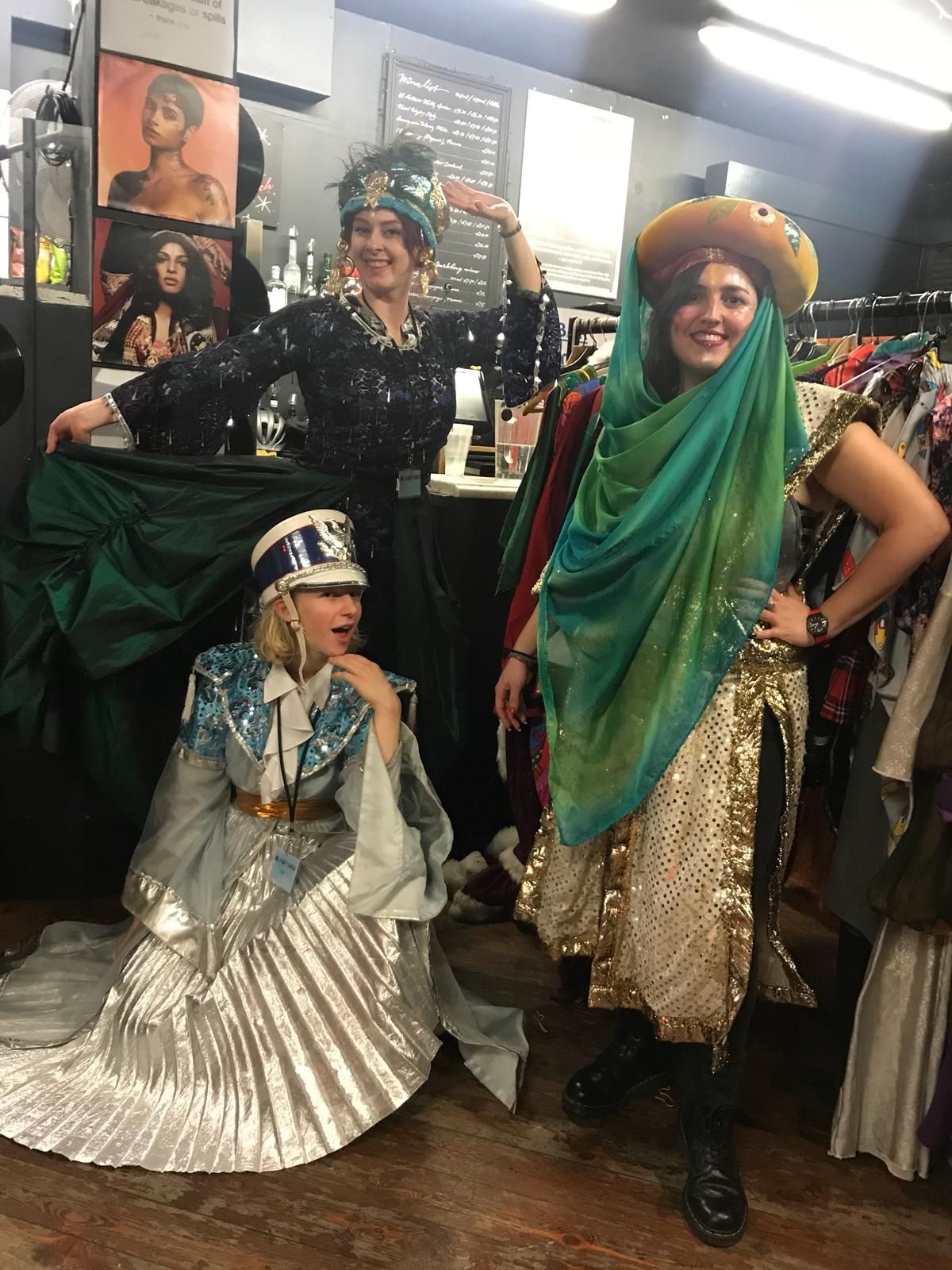 Sarah-Mary (left back), Anna and Claudia get ready to help families at our dress-up corner as part of International Women's Day celebrations at the Komedia arts centre.