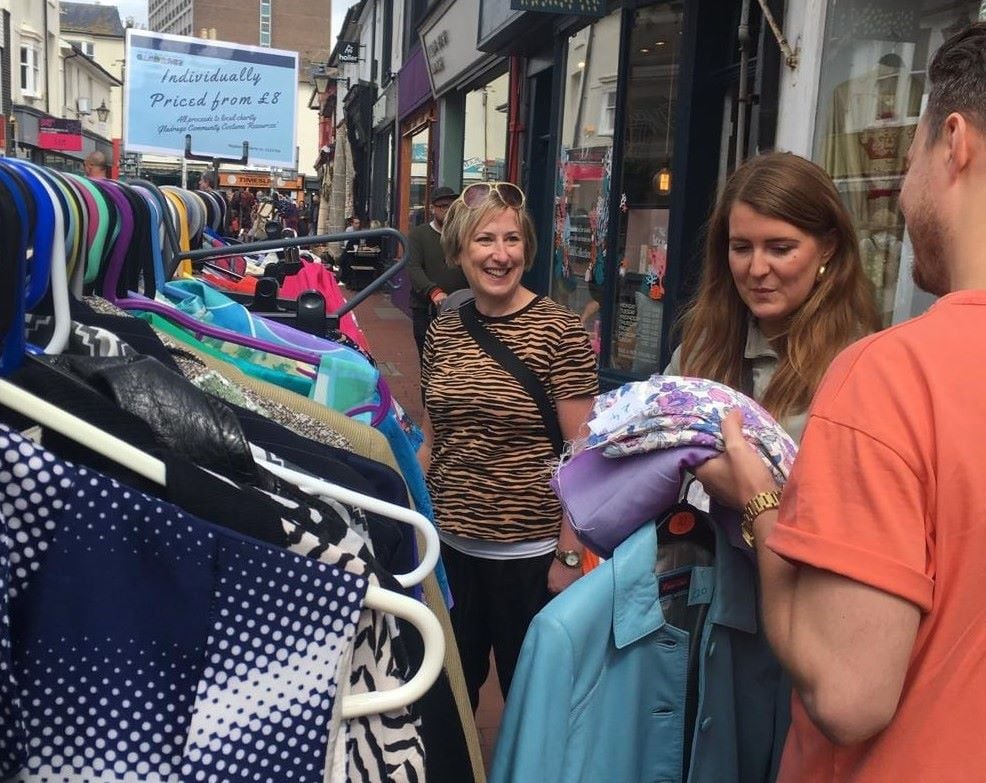 Lara helps customers at a Vintage Sale