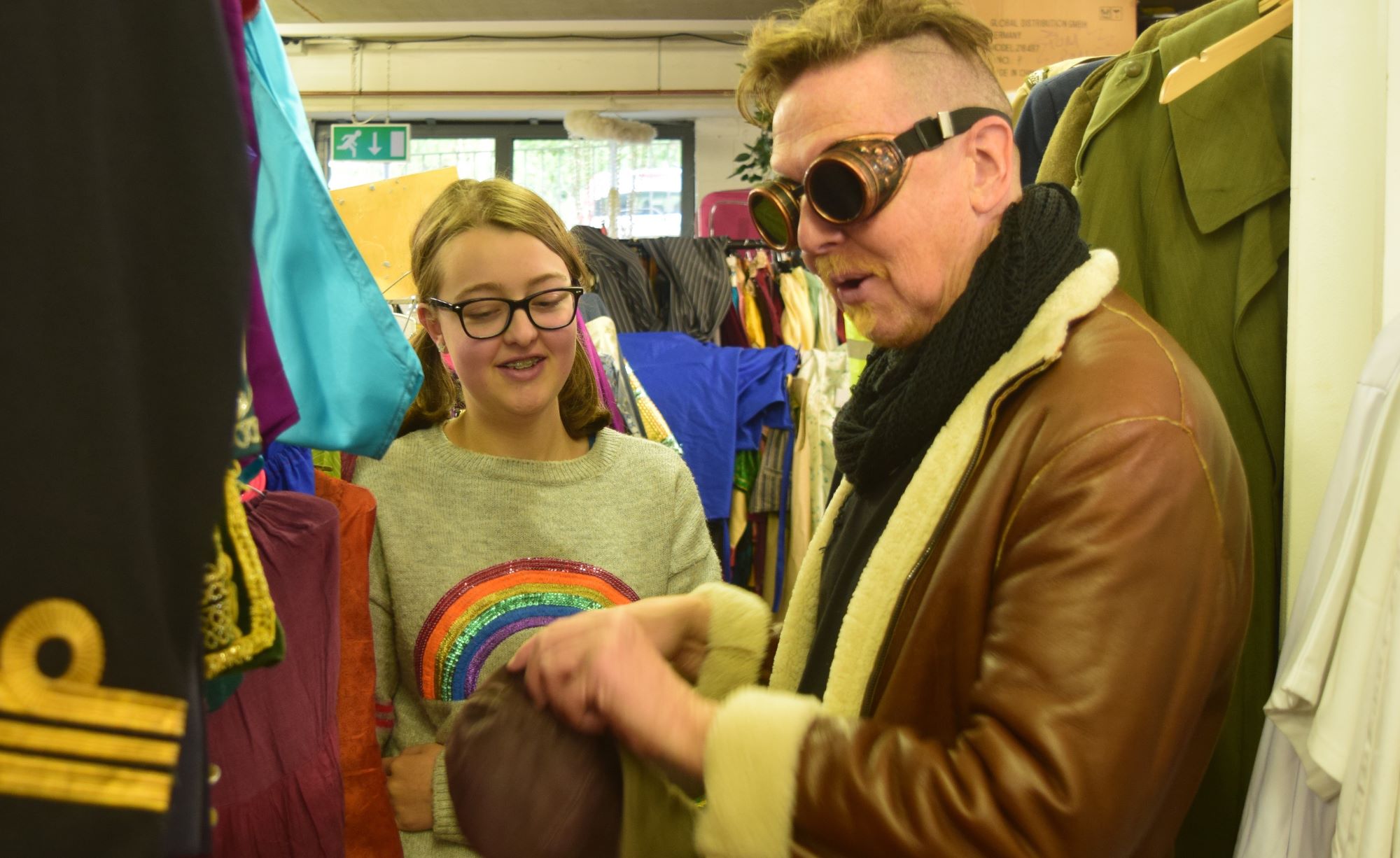 Marilyn secures her last stitch in a jacket   she made from recycled fabric, trimmings and buttons.