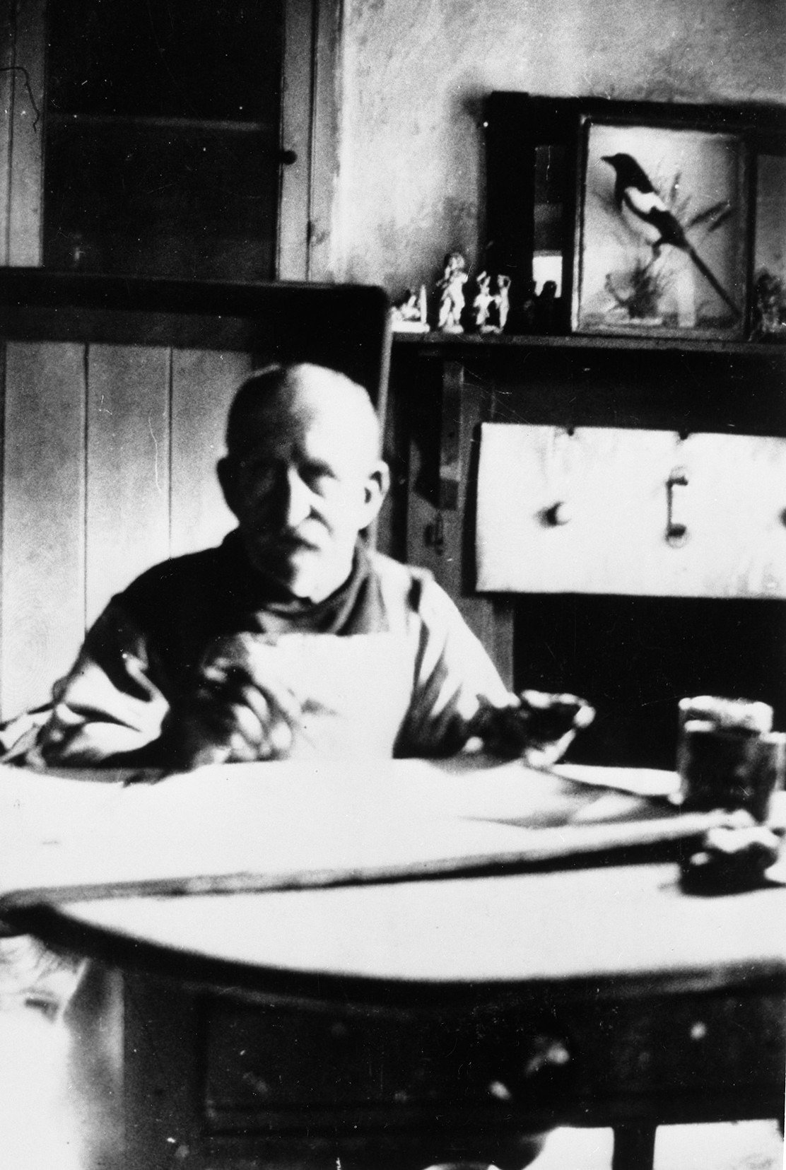 Photograph of Alfred Wallis painting at St Ives in 1928