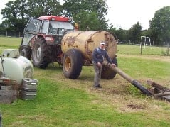 Farmer emptying a septic tank